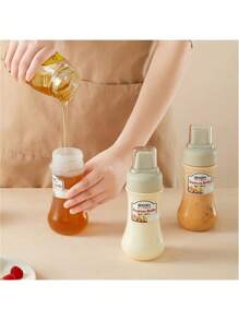 1 pieza Botella para exprimir salsa, recipiente rellenable a prueba de fugas para condimentos como ensalada, salsa de tomate, miel, mermelada, salsa de ostras, utensilios de cocina, artículos escolares