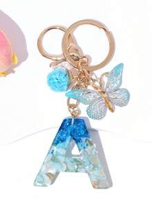 1 szt. Kreatywny, ręcznie robiony motyl, ozdobny brelok z literą z kryształową szklaną kulką w kształcie gwiazdy, zawieszki do torebki i portfela, torba z ozdobnym brelokiem z literą, brelok do kluczyków samochodowych dla kobiet, brelok zapobiegający zgubieniu, prezent na powrót do szkoły dla uczniów, nauczycieli, kolegów z klasy - Niebieski i biały - Zobacz 4