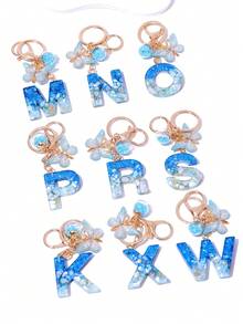 1 szt. Kreatywny, ręcznie robiony motyl, ozdobny brelok z literą z kryształową szklaną kulką w kształcie gwiazdy, zawieszki do torebki i portfela, torba z ozdobnym brelokiem z literą, brelok do kluczyków samochodowych dla kobiet, brelok zapobiegający zgubieniu, prezent na powrót do szkoły dla uczniów, nauczycieli, kolegów z klasy - Niebieski i biały - Zobacz 6