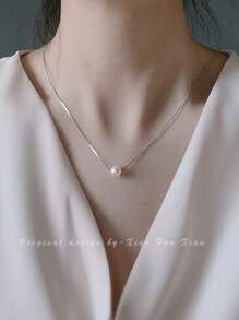 Collar de perlas francesas de lujo ligero para mujer, cadena de suéter de nicho, collar de alta gama, popular cadena de clavícula con colgante