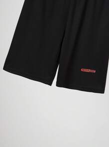 طقم من 2 قطعة من الملابس الرياضية للأولاد المراهقين، بلوزة قصيرة الأكمام ماصة للرطوبة وشورت رياضي