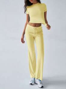 Bộ đồ thể thao mùa hè phong cách Y2K dành cho nữ của GAOVOT, bao gồm áo thun cổ tròn tay ngắn màu trơn và quần ống đứng ôm sát. - Màu vàng - Xem 6