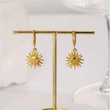 Retro französische Titanstahl-Creolen mit Sonnenanhänger, elegantes Design