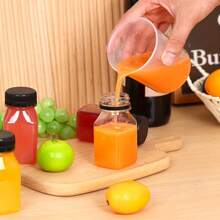 10/20 pièces Bouteilles de jus transparentes de 4 oz avec couvercles noirs anti-fuite, contenants réutilisables pour smoothies, jus, lait et boissons maison - parfaits pour le stockage au réfrigérateur