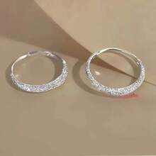 A Pair Of Earrings And Ear Rings That Everyone Loves