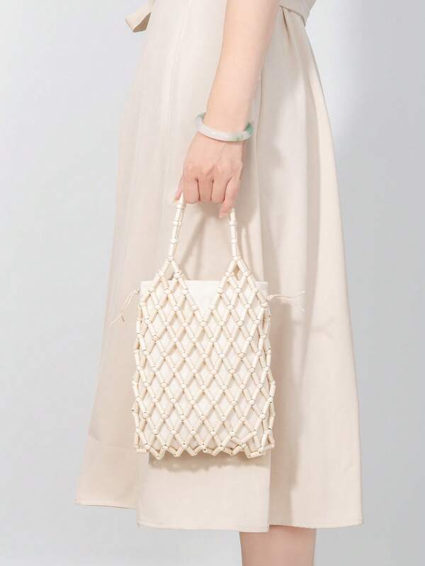 ENSPT Einteiliger, 5-farbiger perlenbesetzter Ausschnitt-Beutel mit Kordelzugverschluss. Die Beutelöffnung kann abgenommen werden und hat eine Innentasche. Diese strandtypische Tasche eignet sich für Damen, die gerne an der Küste sind.