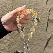 Pulsera de mujer con cuentas de cristal dorado y lazo, correa para teléfono anti-pérdida, regalo de Año Nuevo