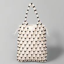 ENSPT Einteiliger, 5-farbiger perlenbesetzter Ausschnitt-Beutel mit Kordelzugverschluss. Die Beutelöffnung kann abgenommen werden und hat eine Innentasche. Diese strandtypische Tasche eignet sich für Damen, die gerne an der Küste sind.