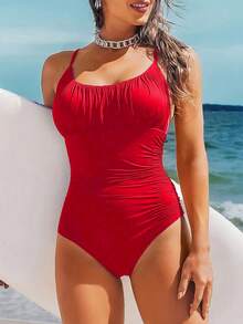 女式黑色纯色连体泳衣，修身显瘦，适合海滩度假