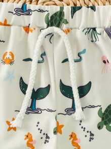 Short de plage à taille élastique avec imprimé requin pour tout-petits garçons, adapté pour les vacances et les voyages