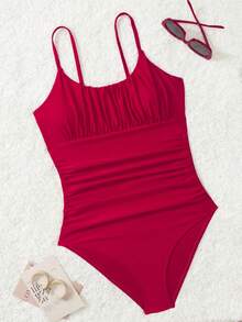 女式黑色纯色连体泳衣，修身显瘦，适合海滩度假