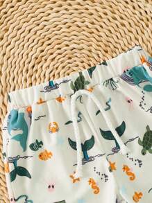 Short de plage à taille élastique avec imprimé requin pour tout-petits garçons, adapté pour les vacances et les voyages