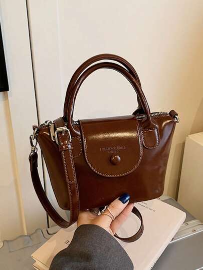 Borsa di alta gamma di nicchia per donna, nuovo stile di quest'anno, borsa a tracolla versatile retrò di moda, borsa shopper, borsa a tracolla, mini borsa con patta, colore unito, borsa da shopping elegante, secchiello