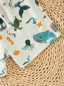 Short de plage à taille élastique avec imprimé requin pour tout-petits garçons, adapté pour les vacances et les voyages