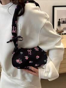 Nouveau sac bandoulière à imprimé floral printemps/été avec ruban et décoration de nœud, sac à épaule léger en polyester, convient pour les trajets et les voyages, noir et blanc avec motif floral rose