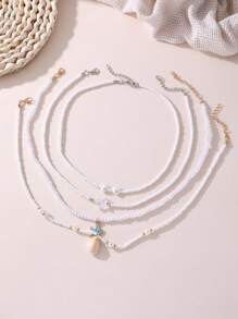 Set de 4 collares con cuentas de perlas con forma de corazón y estrella de mar para niñas