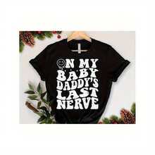 On My Baby Daddy's Last Nerve Shirt,Baby Daddy 220-Gram Heavy-Duty Cotton Jersey With Motivational Quotes, Featuring A Loose Bow Short-Sleeve Top Designed For Curvy, Curvy, Or Oversized Enthusiasts. Suitable For Women Of All Sizes In A Comfortable, Snug Shirt Made Of Breathable Fabric With Beautiful Butterfly Patterns, Exuding Confidence. Perfect For Spring And Summer Outfits, Leisure, Travel, Or Casual Workdays, This Fashionable Top Is Ideal For Big Girls, Positive Body Messages, And Is An Ideal Gift For Sisters, Wives, Or Friends Who Enjoy A Comfortable Appearance.T-Shirt. - Black - View 1