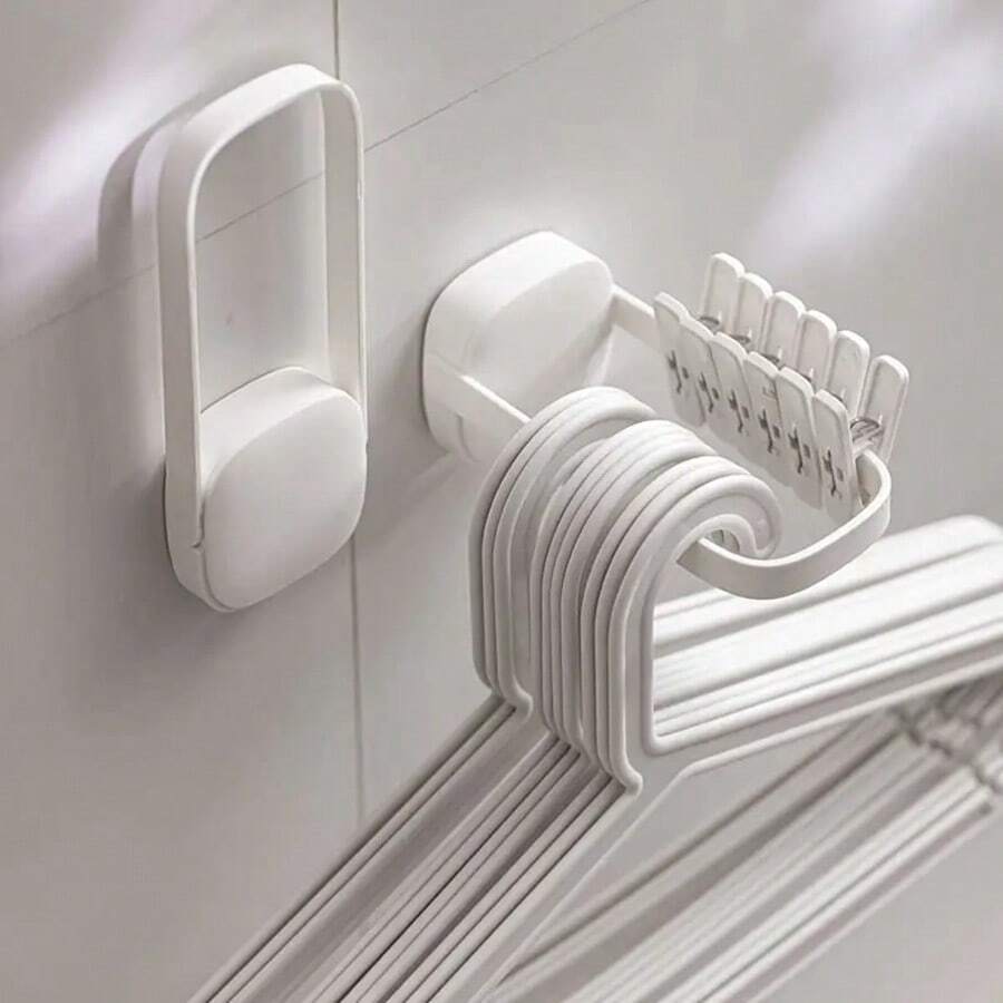 1 件装壁挂式折叠衣架，多功能塑料收纳整理架，未涂漆表面，适用于浴室和阳台，节省空间的洗衣方案，安装简便，现代简约设计，适用于小户型的多功能家居收纳架，轻巧坚固，耐腐蚀防锈塑料材质，易于清洁，可调节挂钩，包含安装配件，适合紧凑型公寓，提升收纳整理效果，透气晾干，防止杂乱，适用于毛巾、衣物和配件。