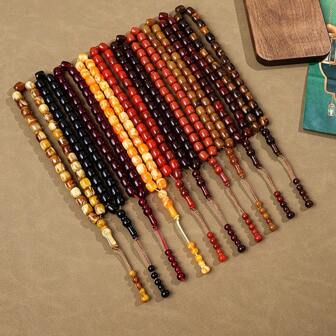 1串33颗珠子的念珠，每颗珠子颜色渐变独特，不对称的“塔斯比赫”（念珠），用于赞美、祈祷、日常生活和旅行。