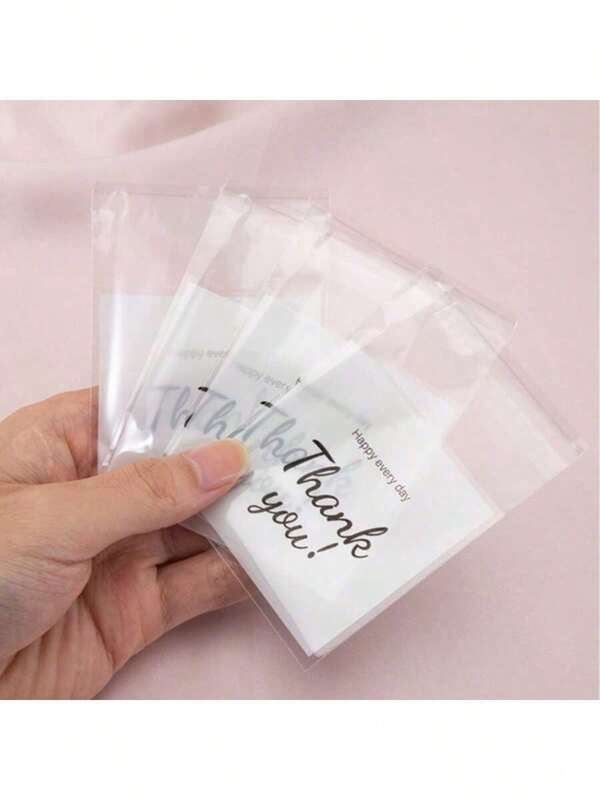 50pcs/100pcs DIY Craft Plastic Bags With "Thank You" English Text, Self-Adhesive Packaging Bags For Holiday Party Gifts, Gift Card Decoration Bags, OPP Bags Printed With "Thank You", Suitable For Party, Birthday, Wedding And Gift Wrapping, Halloween And Christmas Gifts