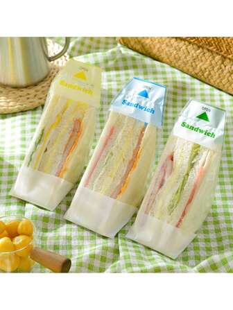 50个装三明治包装袋，透明塑料材质，纸底，易撕设计，适用于咖啡馆、外卖、办公室午餐，时尚实用，方便携带，防漏设计，适合学校便当、旅行野餐、烘焙展示，可爱简约风格，也适用于国庆节、万圣节、圣诞节装饰、派对、聚会、蛋糕盒