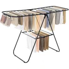 SONGMICS Tendedero de Ropa, con Pinzas para Calcetines, Perchero Metálico para Ropa Sucia, Plegable, Alas Ajustables, Plata y Azul MLLR52BU - Negro - Ver 9