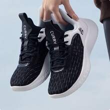 Under Armour Botas de combate Curry Star para hombre CURRY10, zapatillas de baloncesto bajas con amortiguación - Blanco y Negro - Ver 1