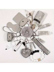 1 set de 15 pièces Porte-clés à strass pour femme - Porte-clés avec sangle de poignet, sac de rangement et accessoires de porte-carte à pompon. Kit d'accessoires de sac, de voiture