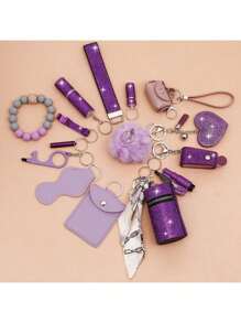 1 set de 15 pièces Porte-clés à strass pour femme - Porte-clés avec sangle de poignet, sac de rangement et accessoires de porte-carte à pompon. Kit d'accessoires de sac, de voiture