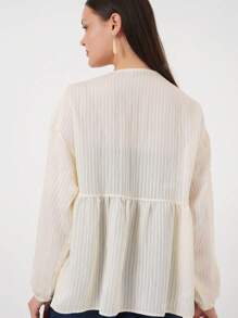 Blusa donna elegante con collo lavorato a costine annodata, tinta unita, adatta per il mare