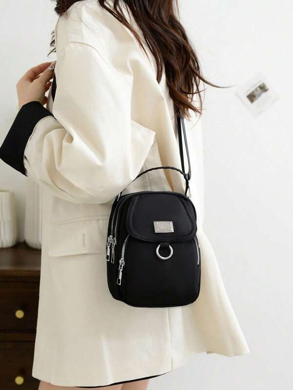 This Is A New Style Of Nylon Multi-Layer Saddle Bag For Women, With A Single Shoulder Strap And A Crossbody Strap. It Features A Multi-Color Design And Is Decorated With Metal Hardware.