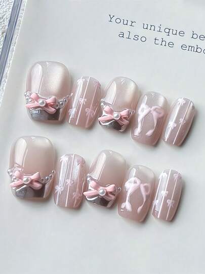 每套10片手工方形短假指甲，银色法式设计，亮粉色猫眼手绘蝴蝶结图案，粉色风格可爱女孩，可重复使用，含工具，可作为女性节日和生日的礼物，适合任何风格的女性日常佩戴