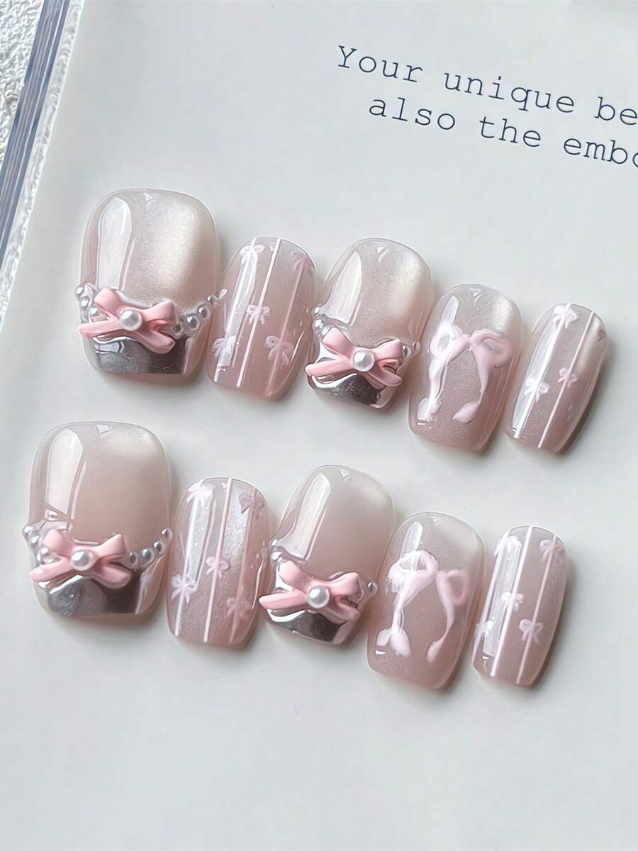 每套10片手工方形短假指甲，银色法式设计，亮粉色猫眼手绘蝴蝶结图案，粉色风格可爱女孩，可重复使用，含工具，可作为女性节日和生日的礼物，适合任何风格的女性日常佩戴 - 彩色 - 查看 1