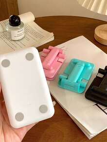 Este suporte de mesa dobrável para celular é perfeito para assistir TV, estudar e trabalhar. É portátil, está disponível em quatro cores e é uma ótima opção de presente de aniversário. - Multicolorido - Ver 2