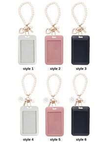 这款黑/白/粉色卡包配有心形吊坠和仿珍珠链，可用作包包装饰、钥匙扣，可收纳身份证、会员卡、照片、地址卡，并起到保护作用。适合日常使用、装饰，或作为礼物送给朋友、家人、爱人，也适合情人节、生日、母亲节、开学季等场合。 - 彩色 - 查看 2