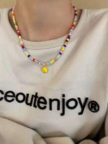 Collana con ciondolo a faccia sorridente in perline, collana da uomo minimalista e colorata, collana stile retrò elegante