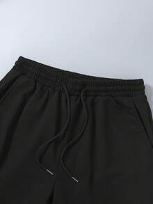 休闲黑色短裤和白色短袖上衣套装，宽松的日常穿搭风格，百搭的简约设计，适合夏季穿着 - 黑與白 - 查看 7