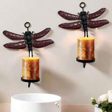 Set de 2 portavelas de pared con diseño de libélula, capaz de sostener velas con un diámetro máximo de 2.25"