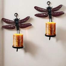 Set de 2 portavelas de pared con diseño de libélula, capaz de sostener velas con un diámetro máximo de 2.25"