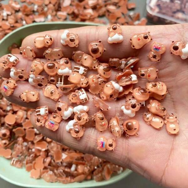 50/100/200 قطعة دمية كابيبارا صغيرة جدًا، تماثيل قوارض تضيء في الظلام، اكسسوارات فن الأظافر DIY [ألوان وأنماط عشوائية] [حجم المنتج مناسب لفن الأظافر وتزيين الهاتف]