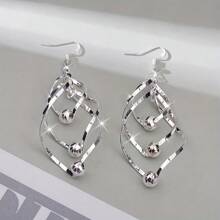 1 Paar gedrehter geometrischer Hänge-Ohrringe mit Metallspirale, dreifachem Kreis, verwirbeltem geschichtetem Ohrpiercing-Design, Anhänger-Ohrringe mit Silberplattierung für Damen und Mädchen für den täglichen Gebrauch