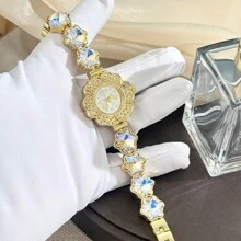 1 pièce Montre-bracelet à cristaux scintillants et cloutée d'étoiles pour femmes, boîtier floral en alliage, montre à quartz haut de gamme de petite taille