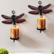Set de 2 portavelas de pared con diseño de libélula, capaz de sostener velas con un diámetro máximo de 2.25"
