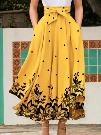 夏季休闲度假波点蝴蝶印花腰系带结左右口袋下摆开叉长裙。