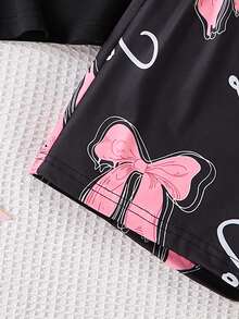 Conjunto de 2 piezas de ropa de estar en casa para niñas de moda, con Top de manga corta negra cuello redondo con estampado rosa de lazo, a juego con pantalones cortos o pantalones completos con estampado rosa de lazo, adecuado para uso casual en casa en verano - Negro - Ver 6