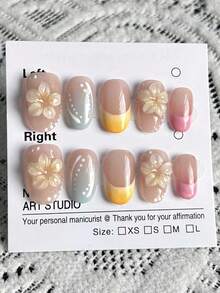 10片手工制作的短款美甲贴片，圣诞礼物，假指甲，短款美甲贴片，裸色搭配马卡龙配色，手工捏制3D花朵，手绘渐变风格，白色线条，波点纹理装饰，清新甜美，短款椭圆形，可拆卸美甲贴片，附赠工具包；适合爱美的女孩日常佩戴，也可作为节日礼物。 - 彩色 - 查看 4