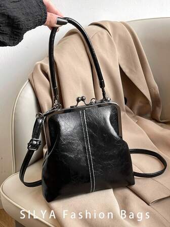 2025 新款时尚复古 PU 材质手提包，可拆卸女士单肩包，配有纽扣开合钱包。