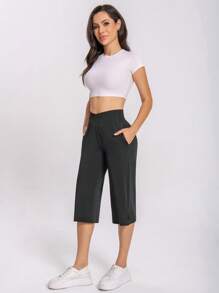 1 pièce Pantalon de sport décontracté pour femmes, nouveau pantalon d'été en couleur unie, respirant, avec une grande élasticité et un confort, longueur 7/8 fabriqué en tissu élastique avec design de taille croisée, convient pour la rue, le tennis, les loisirs, facile à enfiler et à enlever, pantalon de jogging pour enrichir votre vie