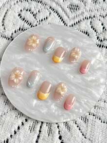10片手工制作的短款美甲贴片，圣诞礼物，假指甲，短款美甲贴片，裸色搭配马卡龙配色，手工捏制3D花朵，手绘渐变风格，白色线条，波点纹理装饰，清新甜美，短款椭圆形，可拆卸美甲贴片，附赠工具包；适合爱美的女孩日常佩戴，也可作为节日礼物。 - 彩色 - 查看 3
