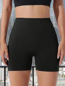 Pantalones cortos deportivos de color liso para mujer/sin costuras/cintura en V, shorts de yoga y gimnasio sexys que realzan el trasero - Negro - Ver 3